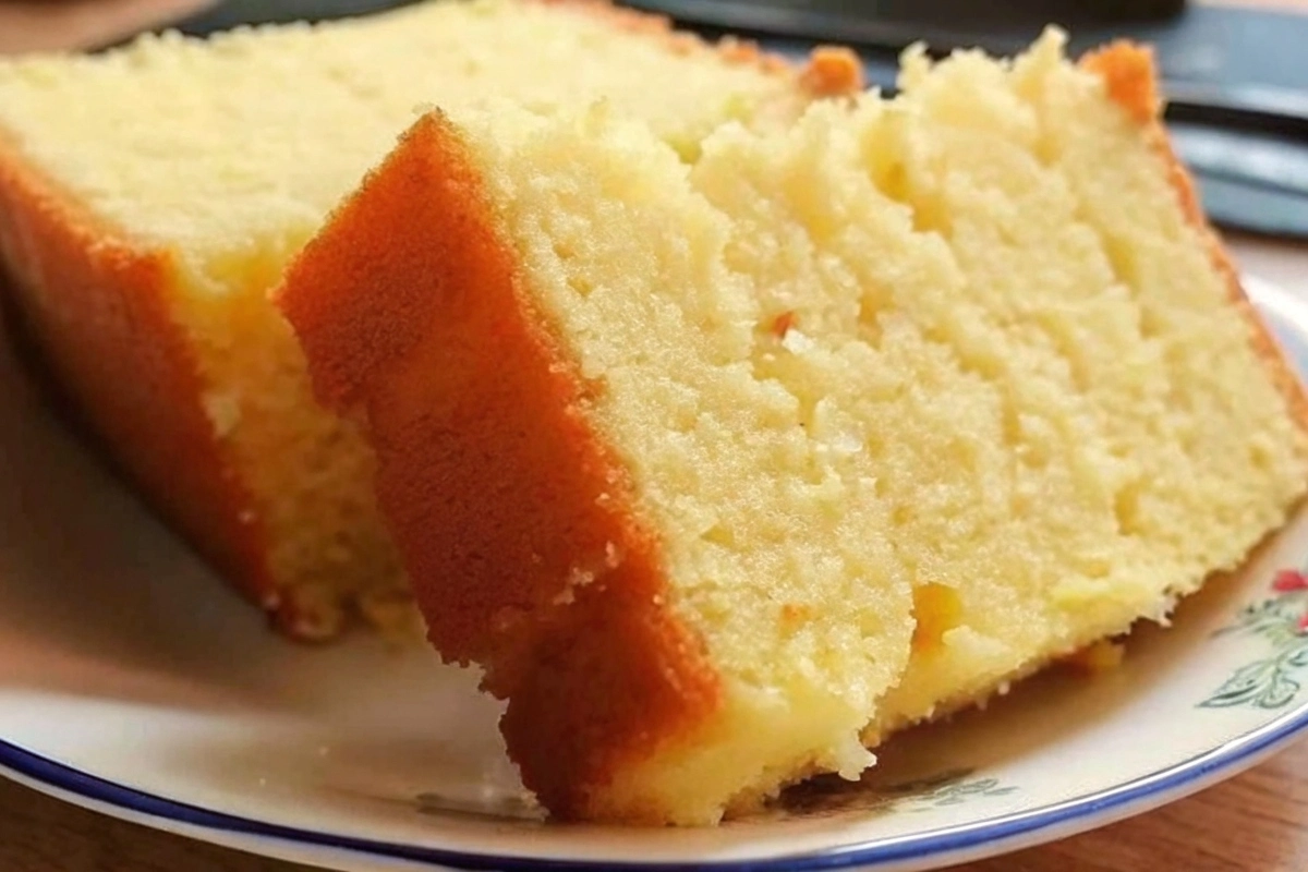 Slice of moist butter cake with light frosting