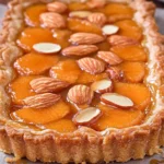 Freshly baked Apricot Almond Tart with golden crust and glazed apricots