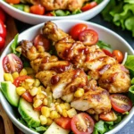 Honey mustard chicken salad with grilled chicken, mixed greens, and nuts
