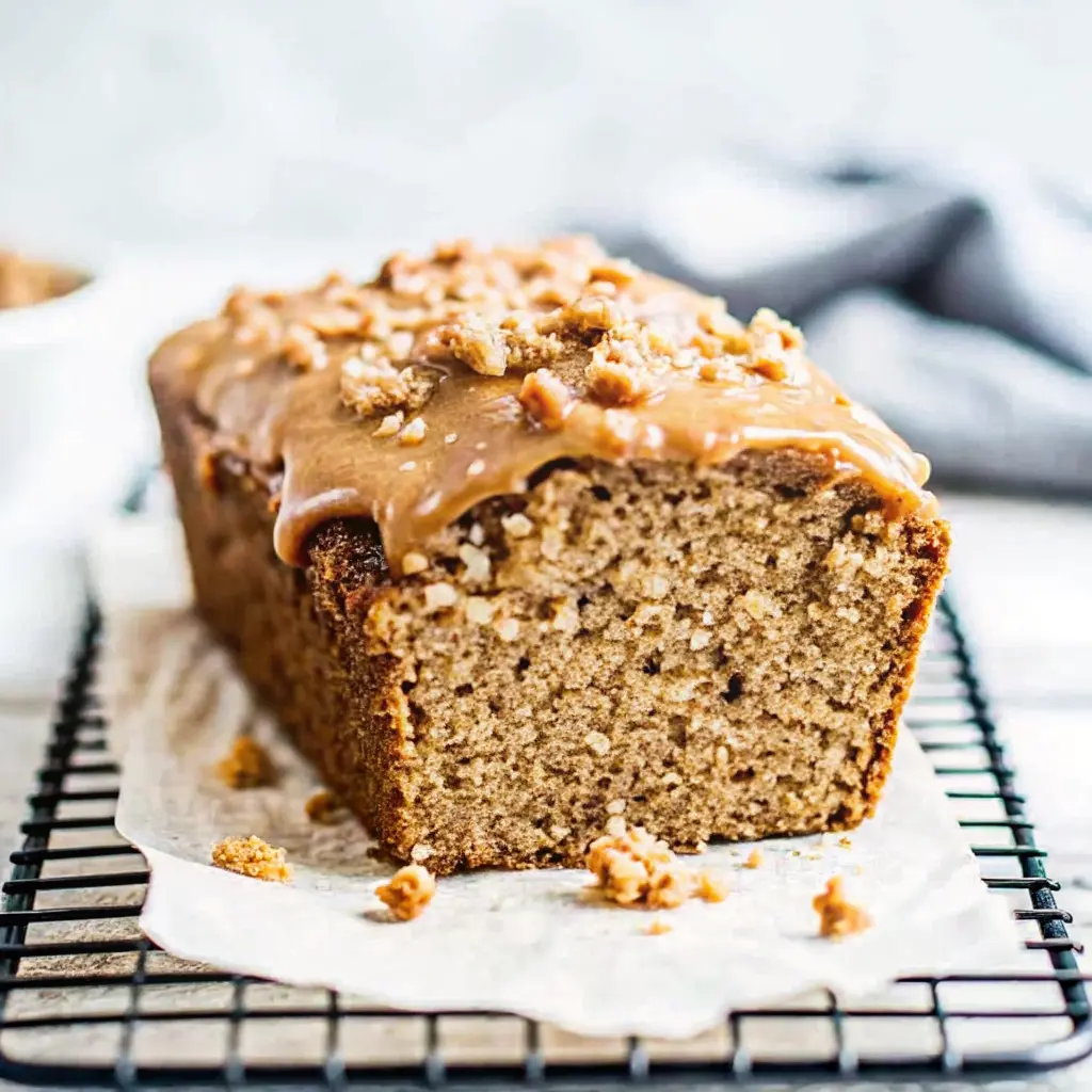 Moist cookie butter banana bread loaf with swirls of creamy speculoos spread