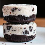 Frozen Oreo fat bombs in silicone molds with cookie crumbs