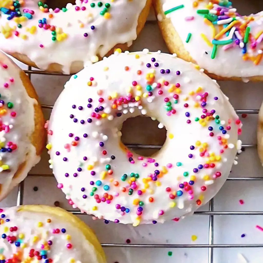 Colorful Funfetti Birthday Cake Donuts with vanilla glaze and rainbow sprinkles