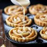 Grilled apple pie cinnamon roll cups in muffin tin with caramelized edges