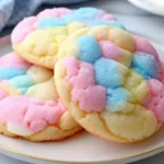 Swirled pink and blue cotton candy cookies on a cooling rack