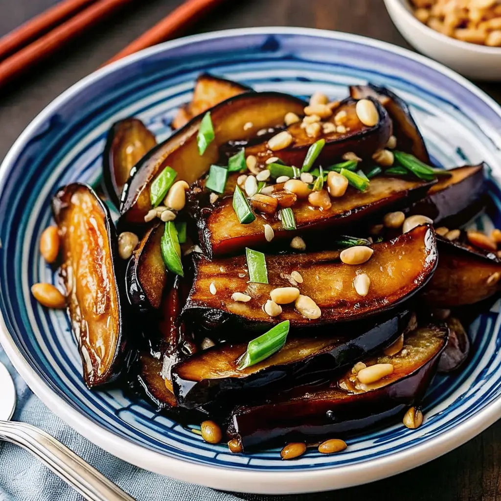 Silky eggplant pieces coated in glossy garlic sauce in a wok Eggplant with Garlic Sauce Stir Fry