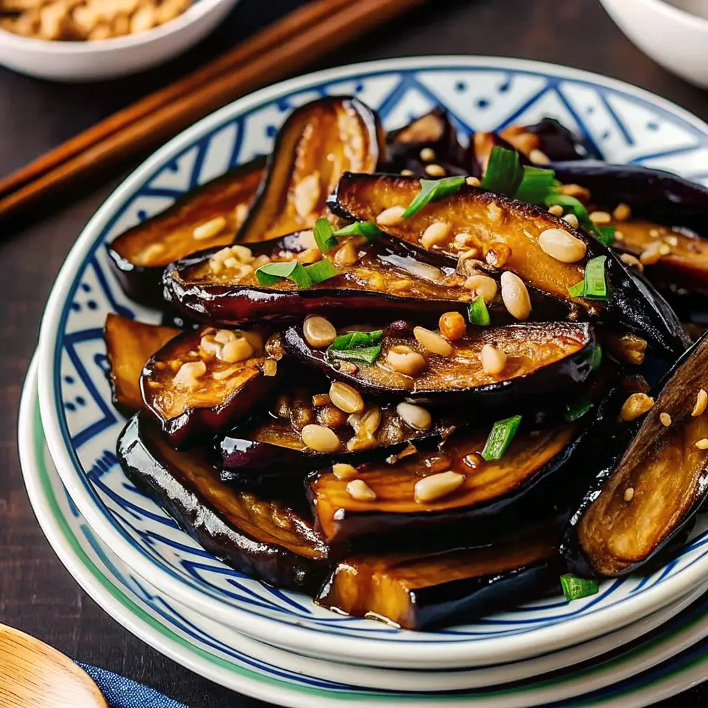 Silky eggplant pieces coated in glossy garlic sauce in a wok Eggplant with Garlic Sauce Stir Fry