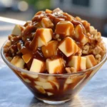 Caramel Apple Salad in a serving bowl with caramel drizzle