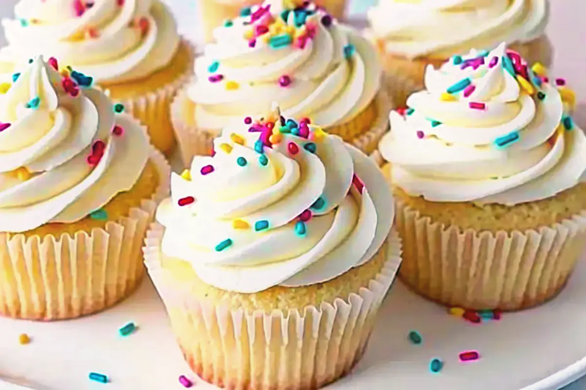 Classic vanilla birthday cupcakes with buttercream swirl and sprinkles