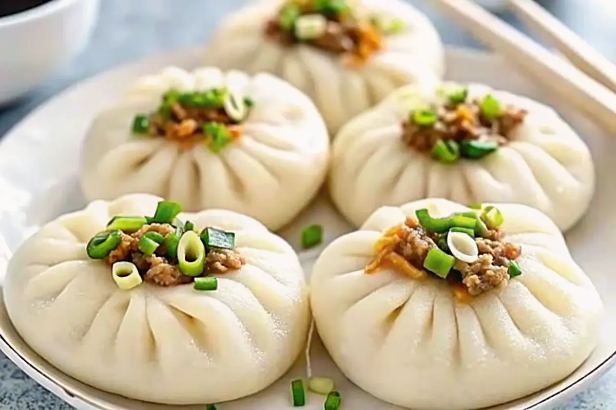 Steamed Chinese Meat Buns (Baozi) with fluffy dough and savory pork filling