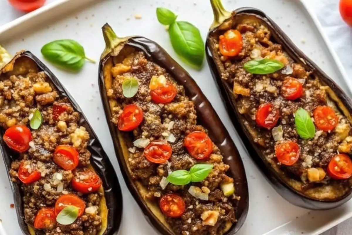Vegan stuffed eggplant baked with grains, vegetables, and herbs
