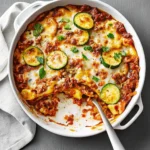 Cheesy zucchini pizza casserole in baking dish