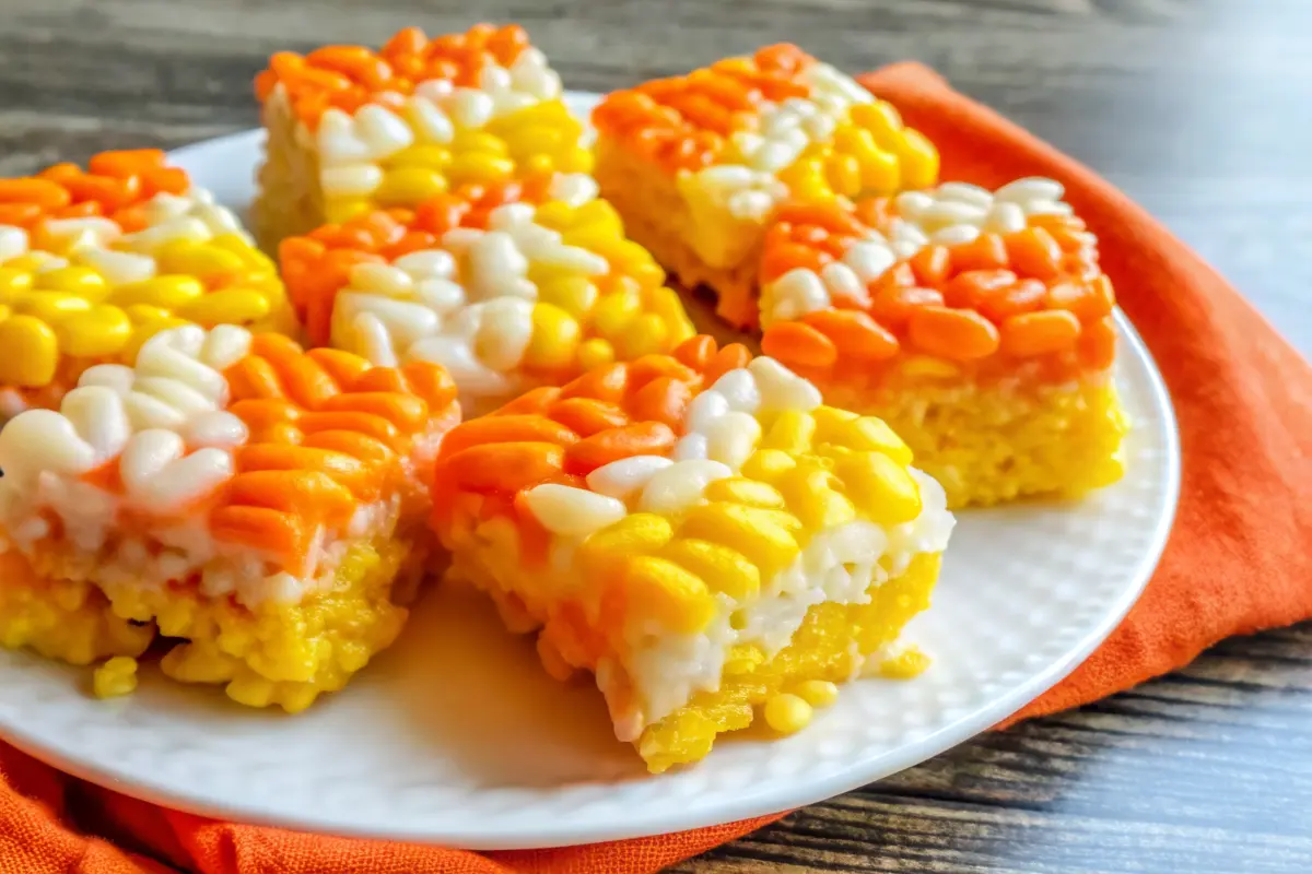 Candy Corn Rice Krispies Treats Recipe triangles with white, orange, and yellow layers