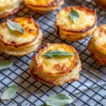 Mini Potato Gratin stacks with crispy golden tops in a muffin tin