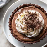 Chocolate Espresso Cream Pie with whipped cream and chocolate curls