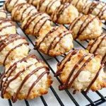 Chewy coconut almond macaroons on a parchment-lined baking tray