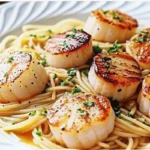 Golden seared sea scallops over silky angel hair pasta Sea Scallops with Angel Hair Pasta