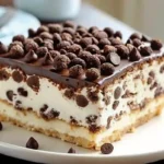 Sicilian Cannoli Cake with chocolate ganache drip and pistachio garnish