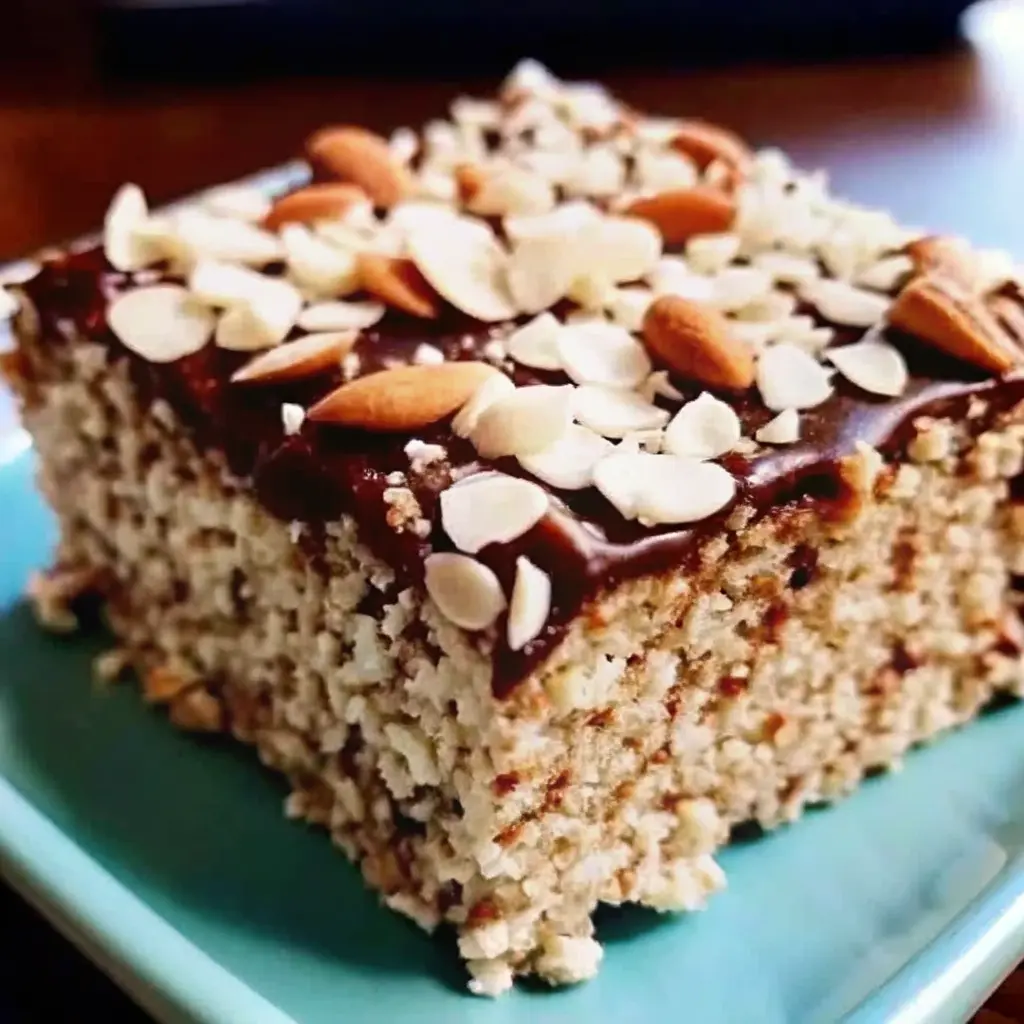 Almond Joy Krispie Treats with chocolate drizzle, coconut, and almonds