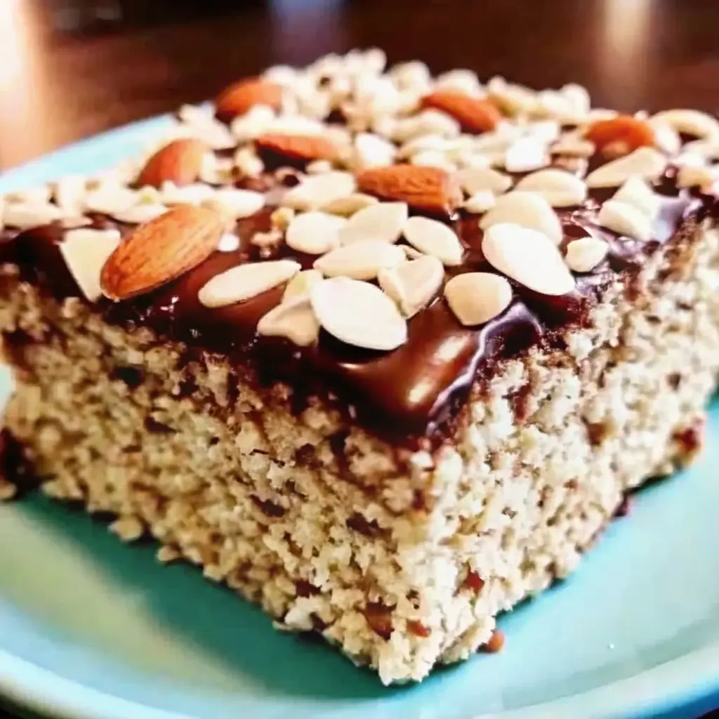 Almond Joy Krispie Treats with chocolate drizzle, coconut, and almonds