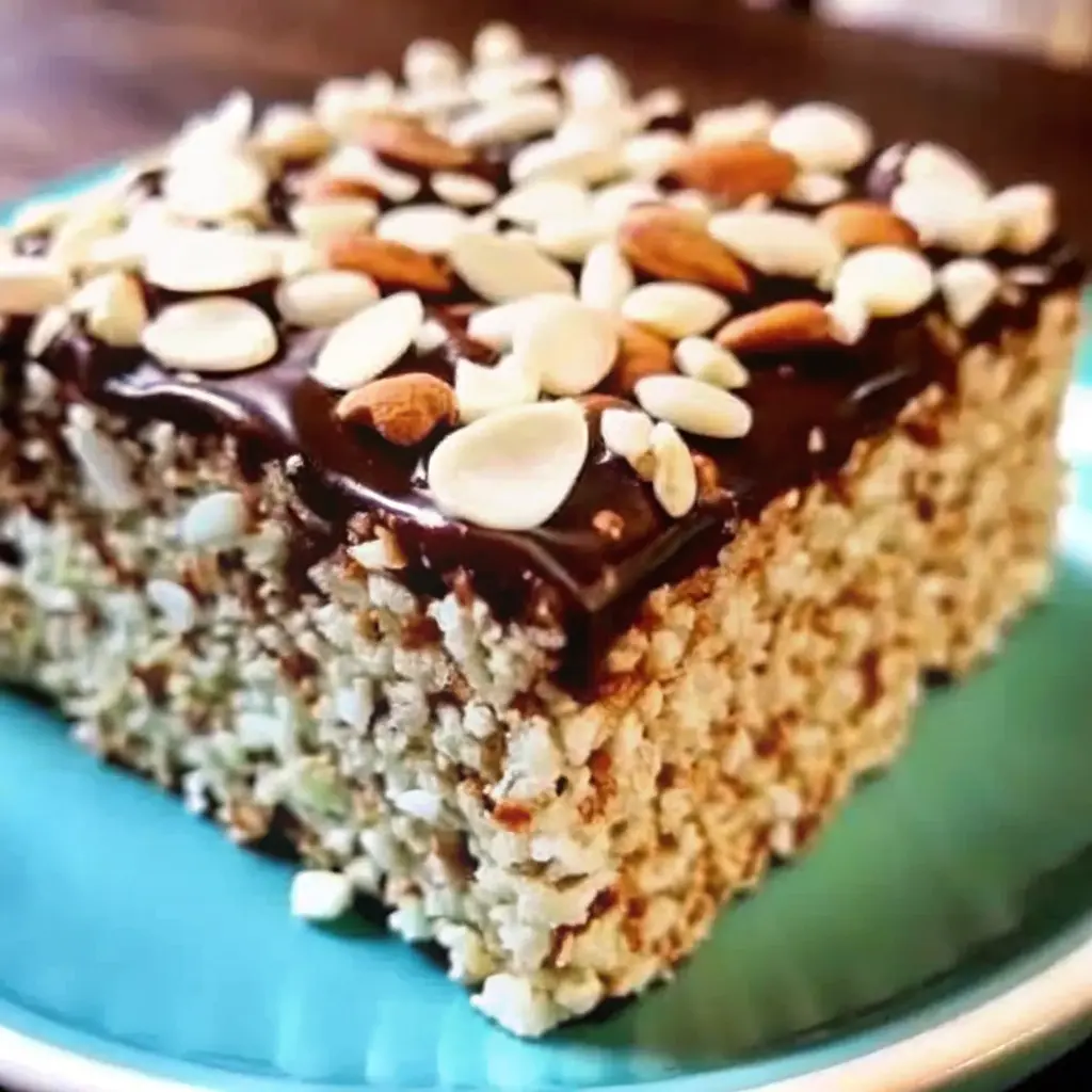 Almond Joy Krispie Treats with chocolate drizzle, coconut, and almonds