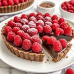 No-bake chocolate raspberry tart with ganache and fresh raspberries