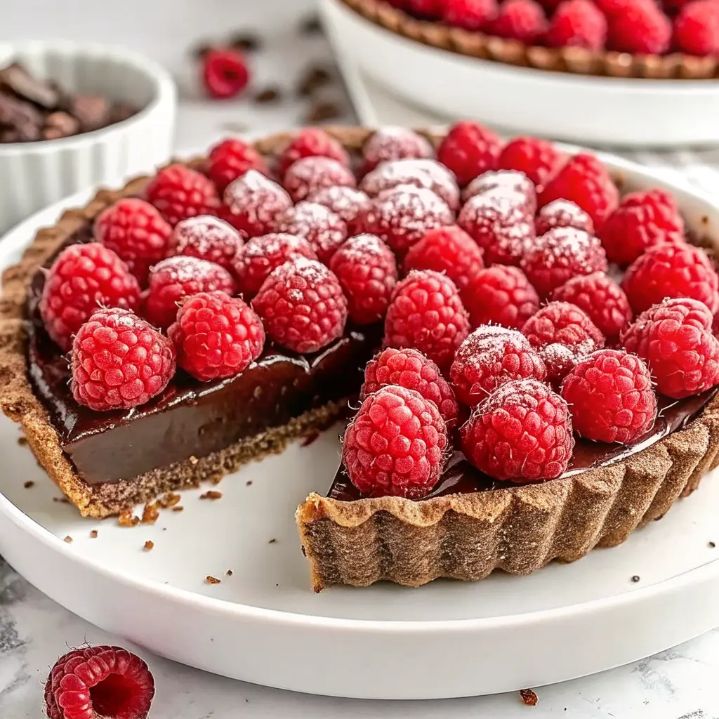 No-bake chocolate raspberry tart with ganache and fresh raspberries