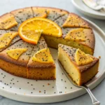 Persian orange cake with cardamom and poppy seeds topped with orange glaze