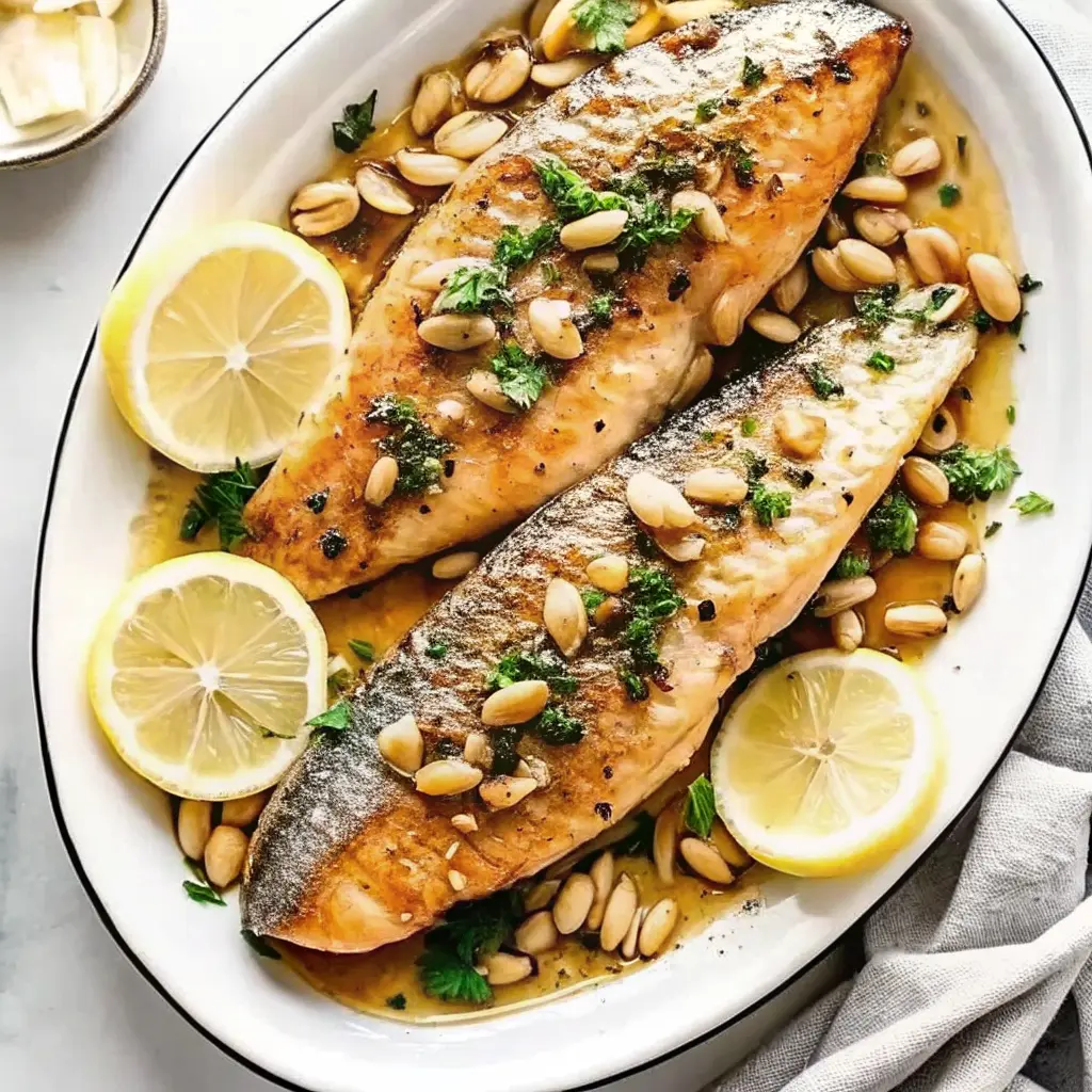 Trout amandine with brown butter and toasted almonds in a skillet