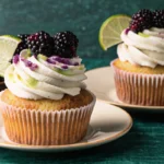 Blackberry lime cheesecake cupcakes with graham cracker crust and blackberry swirl topping