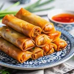Crispy Chinese spring rolls served with dipping sauce