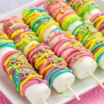 Easter marshmallow pops decorated with pastel sprinkles