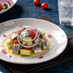 sardine & avocado salad in a bowl with fresh vegetables