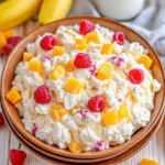 Ambrosia salad recipe with fruit and marshmallows in a glass bowl