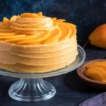 eggless mango cake recipe sliced with fresh mango topping