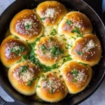 Fresh Ukrainian garlic bread pampushky with garlic and dill topping