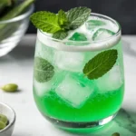 Sugar Snap Pea Mojito Mocktail in a glass with mint and lime garnish