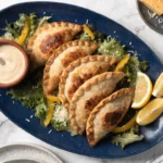 Crispy Chicken Caesar Smash Tacos topped with romaine, Parmesan, and Caesar dressing