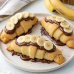 Chocolate Banana Crescents Recipe with flaky pastry, melted chocolate, and fresh banana slices
