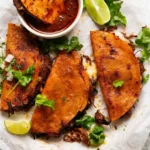 Crispy beef birria tacos with consommé for dipping