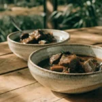 Classic slow-braised beef stew with tender beef, carrots, potatoes, and rich gravy