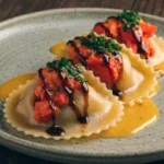 Lobster ravioli with creamy garlic Parmesan sauce garnished with fresh parsley