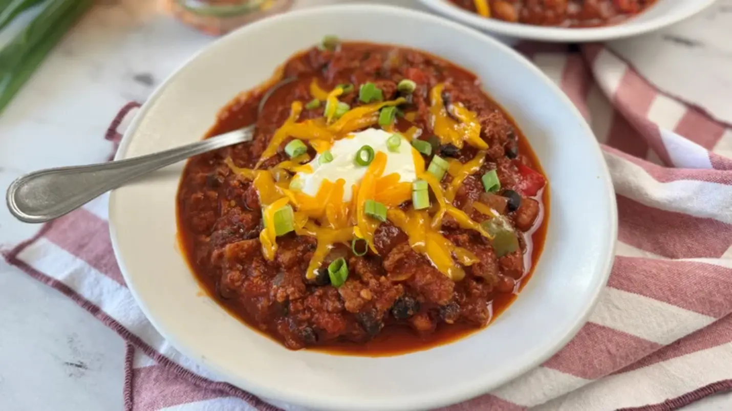 Roasty Toasty Bourbon Chili Recipe with ground beef, beans, and smoky peppers